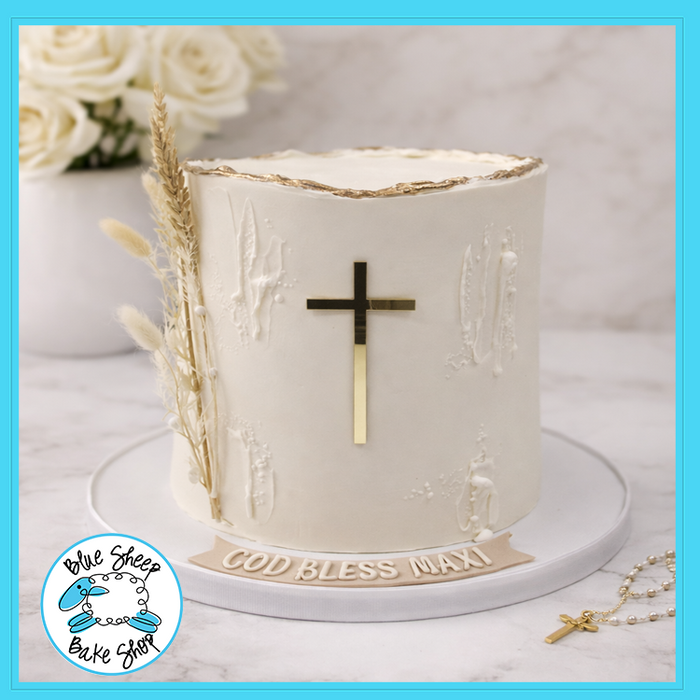 Elegant ivory buttercream confirmation cake with gold cross topper, wheat accents and gold leaf edge from Blue Sheep Bake Shop in Somerville NJ