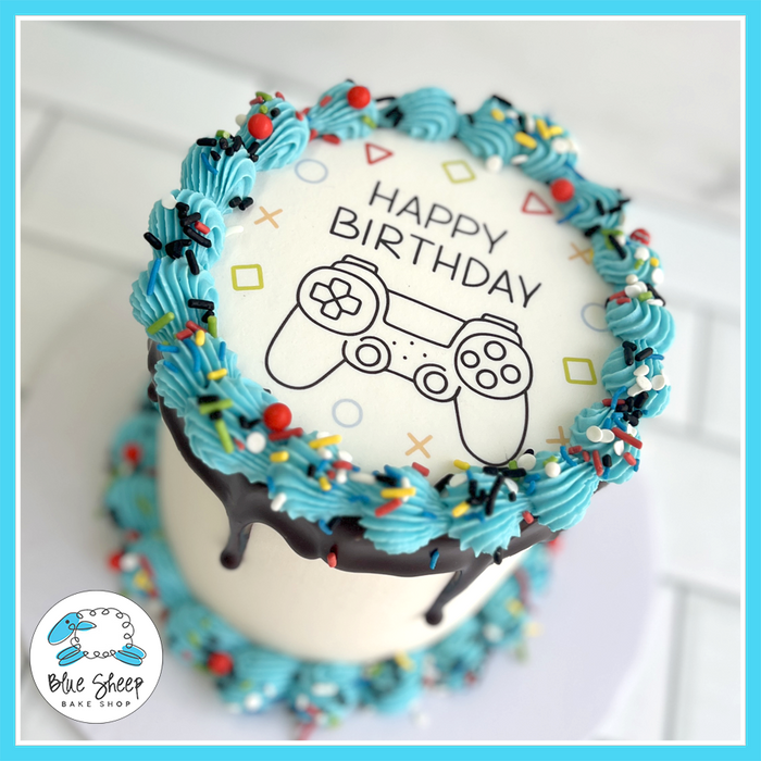 Gamer birthday cake with video game controller design, chocolate ganache drip, and blue frosting | Blue Sheep Bake Shop in Somerville NJ