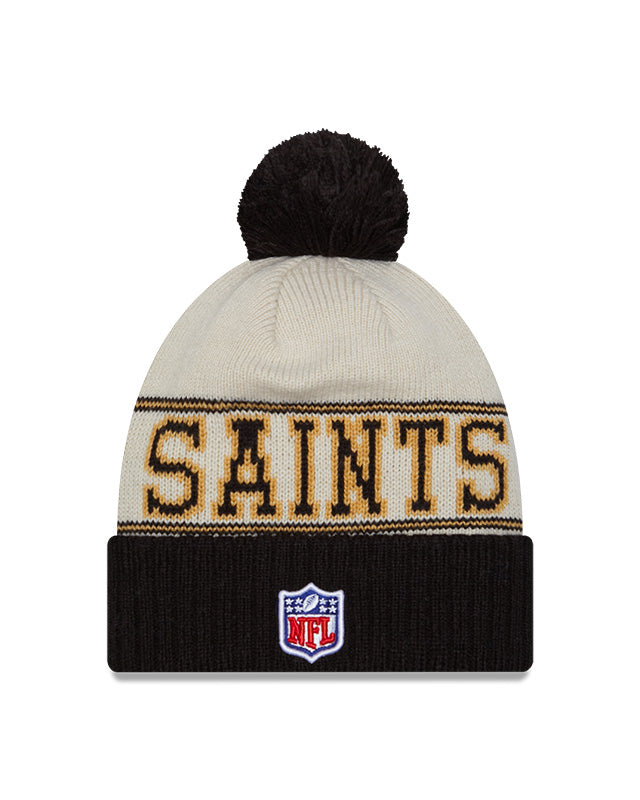 New Orleans Saints New Era 2023 Sideline Historic Pom Cuffed Knit Hat - Cream/Black