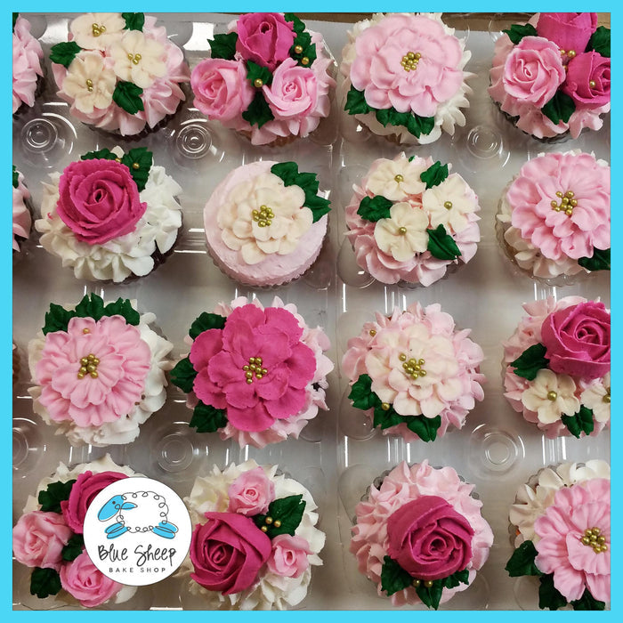 Floral cupcakes decorated with pink, ivory, and green buttercream flowers – perfect for bridal showers and baby showers at Blue Sheep Bake Shop Somerville NJ