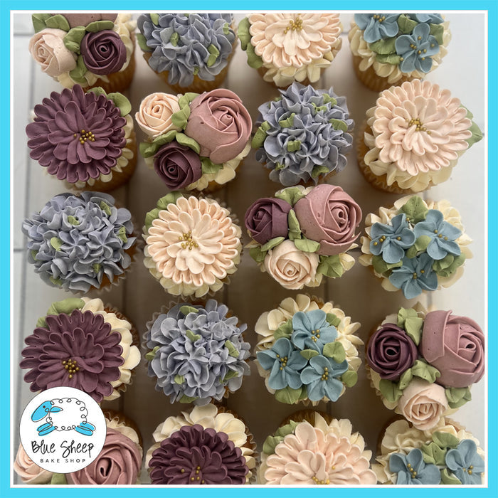 Tea Party Soiree cupcakes with intricate buttercream flowers in pastel colors, perfect for elegant gatherings.