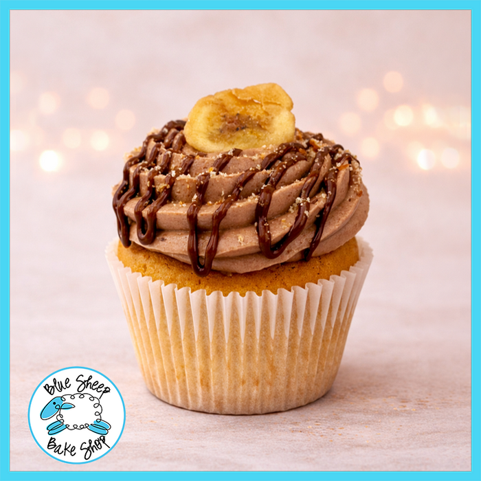 Banana Nutella cupcake made with banana cake, Nutella filling, Nutella buttercream, Nutella drizzle, banana chip, and Nilla wafer crumble from Blue Sheep Bake Shop in Somerville NJ