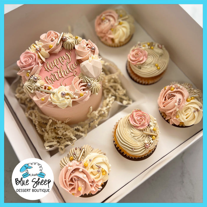 Blush Blossoms Birthday Bento Box with a mini cake and floral-themed cupcakes