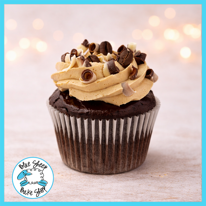 Chocolate espresso cupcake filled with chocolate ganache and topped with espresso buttercream, marble chocolate curls, and coffee beans from Blue Sheep Bake Shop in Somerville NJ