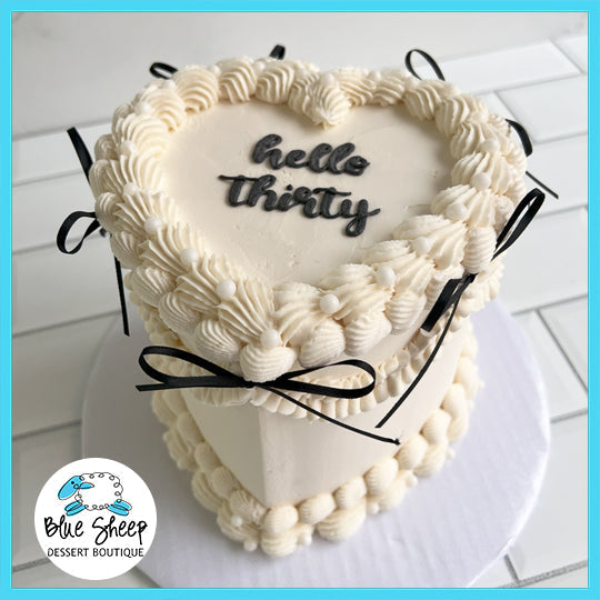 Gluten-free Message in a Heart Birthday Cake with personalized heart-shaped message and colorful buttercream frosting from Blue Sheep Bake Shop