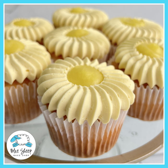 Lemon cupcakes with piped lemon Swiss buttercream frosting and lemon curd filling, flower-style design | Blue Sheep Bake Shop Somerville NJ