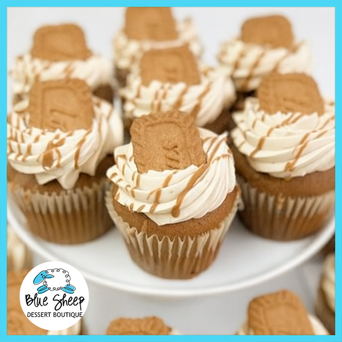 Pumpkin cupcake filled with Biscoff cookie butter and topped with cookie butter Swiss buttercream, a Lotus cookie, and drizzle from Blue Sheep Bake Shop in Somerville NJ.