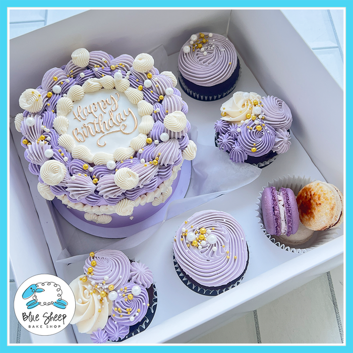 Purple princess bento cake gift box with cupcakes and macarons decorated in lavender, ivory, and gold | Blue Sheep Bake Shop