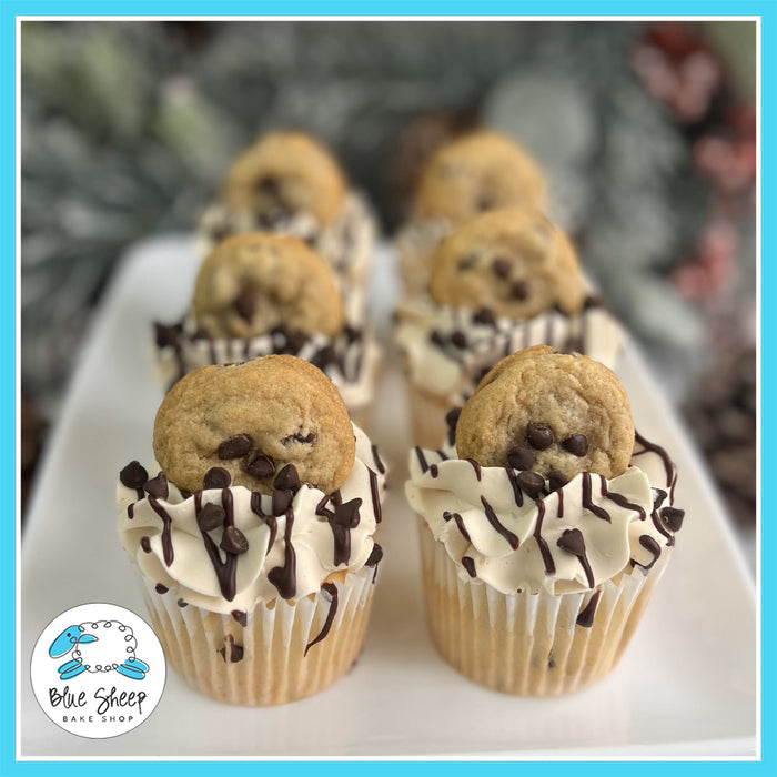 Santa’s Milk & Cookies Cupcakes with cookie dough filling, cookie dough Swiss buttercream, and a mini chocolate chip cookie on top.