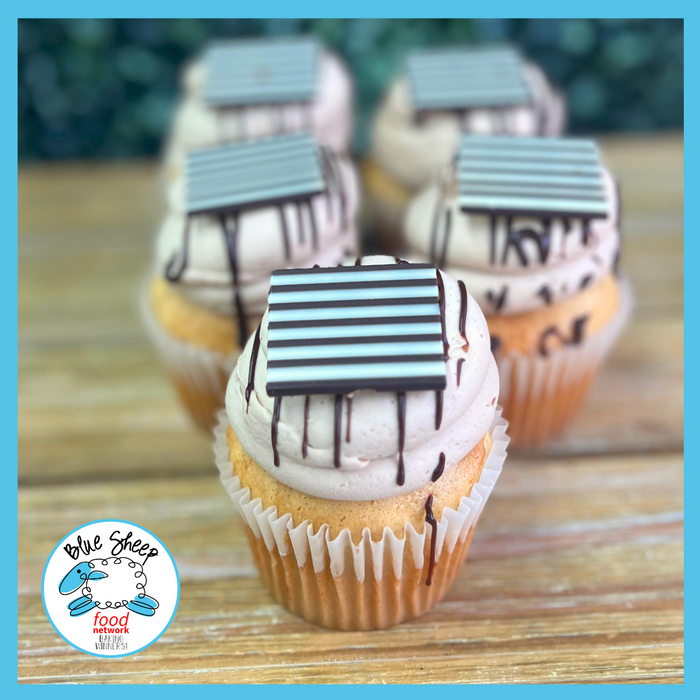 Screwball Peanut Butter Whiskey-infused cupcake with Godiva chocolate Swiss buttercream and decorative chocolate topping.