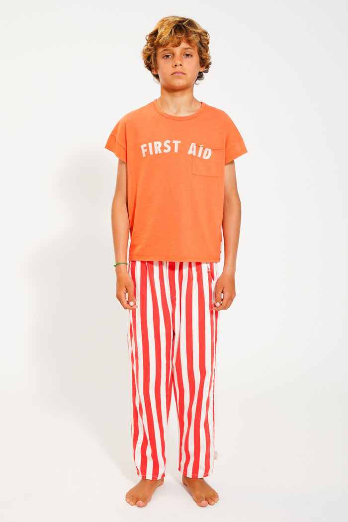 T-Shirt in Orange w/ "First Aid" Print