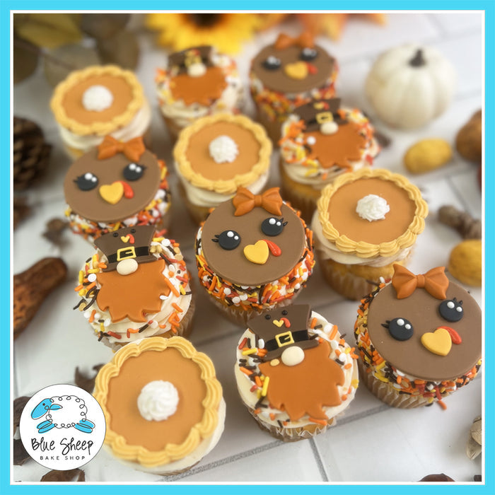 Thanksgiving cupcakes with turkey designs, pumpkin pie toppers, and pilgrim-themed decorations