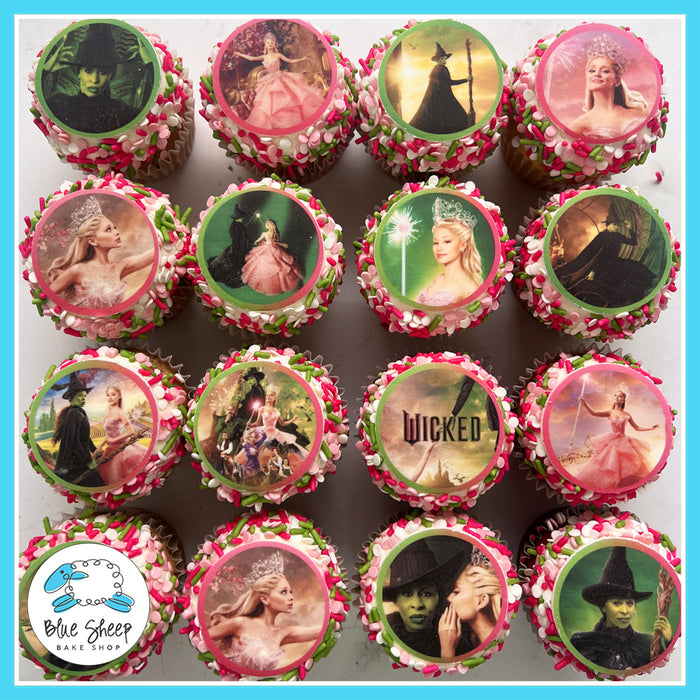 Wicked-themed cupcakes decorated with edible images of Glinda, Elphaba, and scenes from the Wicked musical, available at Blue Sheep Bake Shop in Somerville, NJ